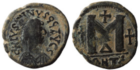 Justin I, 518-527. Follis (bronze, 14.06 g, 33 mm), Antioch. D N IYSTINYS PP AYC S Diademed and draped bust of Justin I to right. Rev. Large M between...