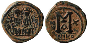 Justin II, with Sophia, 565-578. Half Follis (bronze, 14.82 g, 29 mm), Nicomedia. Justin, holding globus cruciger, and Sophia, holding cruciform scept...