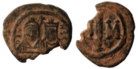 Justin II, with Sophia, 565-578. Decanummium (bronze, 2.89 g, 18 mm), Carthage. Facing busts of Justin, wearing helmet and cuirass, and Sophia, wearin...