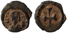 VANDALS. Uncertain. 5/6th century. Nummus (bronze, 0.69 g, 10 mm). Diademed head right. Rev. Cross within wreath. Good fine.