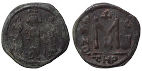Ummayad Califate. cca. 640s. Ae fals (bronze, 4.99 g, 27 mm), Arab-Byzantine type. Three standing figures. Rev. Large M, ANNO to right, X/IIII (?) to ...