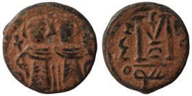 Umayyad Caliphate. Uncertain period (pre-reform), AH 41-77 / AD 661-697. Fals (bronze, 2.93 g, 17 mm), Arab-Byzantine type, Dimashq (Damascus). Two im...