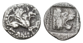 TROAS. Assos. (Circa 500-450 BC). AR Obol.
Obv: Griffin seated to right, raising forepaw
Rev: Head of roaring lion to right within shallow incuse sq...