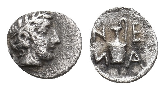 TROAS. Neandria. (4th century BC). AR Tetartemorion.
Obv: Laureate head of Apol...