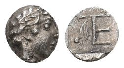 IONIA. Kolophon. (Circa 450-410 BC). AR Tetartemorion
Obv:Laureate head of Apollo to right.
Rev: Monogram of TE (mark of value); to left, laurel spr...