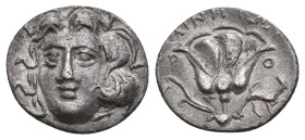 CARIA. Rhodes. (Circa 304-166 BC). AR Drachm. Ainetor, magistrate.
Obv: Head of Helios facing slightly left.
Rev: ΑΙΝΗΤΩΡ / P - O.
Rose with bud to...