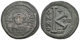 JUSTINIAN I, 527-565 AD. AE, Half Follis. Theoupolis (Antioch).
Obv: D N IVSTINIANVS P P AVG.
Helmeted, draped and cuirassed bust facing, holding gl...