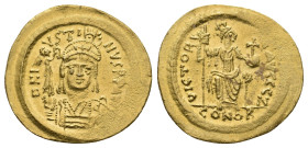JUSTIN II, 565-578 AD. AV, Solidus. Constantinople.
Obv: D N IVSTINVS P P AVG.
Helmeted and cuirassed bust facing, holding globus surmounted by crow...