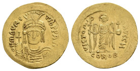 MAURICE TIBERIUS, 582-602 AD. AV, Solidus. Constantinople.
Obv: δ N MAVRC TIЬ P P AV[G].
Draped and cuirassed facing bust, wearing plumed helmet and...