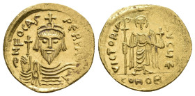PHOCAS, 602-610 AD. AV, Solidus. Constantinople.
Obv: δN FOCAS PЄRP A[VI].
Crowned and cuirassed facing bust, holding globus cruciger.
Rev: VICTORI...