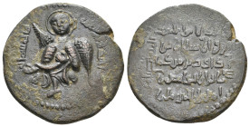 Islamic. Anatolia & al-Jazira (Post-Seljuk). Artuqids. NUR AL-DIN MUHAMMED, 1174-1185 AD / 570-581 AH. AE, Dirham.
Obv: Winged angel, aureolate, hold...