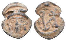 PB Byzantine seal (6th-7th century AD).
Obv: Bearded bust of nimbate saint. Wreath border.
Rev: Cruciform monogram; to l., star. Wreath border.
Con...