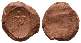 Graeco-Roman clay seal impression (1st-3rd century AD).
Obv: Soldier standing facing, head to right, holding spear and bridle of horse who stands to ...