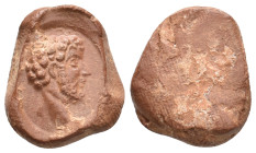 Graeco-Roman clay seal impression (2nd century AD).
Obv: Bare head of Commodus?, r.
Rev: Blank.
Condition: Extremely Fine.
Weight: 1.95 g.
Diamet...