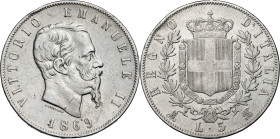 Italia. 1869. Víctor Manuel II. M (Milán). BN. 5 liras. (Kr. 8.3). Golpecitos. AG. 24,77 g. MBC-.