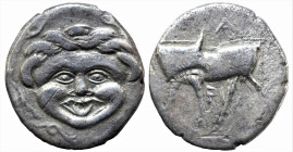 Greek
MYSIA. Parion. (4th century BC). 
AR Hemidrachm (12.1mm 2.01g) 
Obv: Facing gorgoneion.
Rev: ΠAPI Bull standing left, head turned back to right....