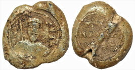 Byzantine Lead Seal (6th-8th centuries)
Obv: Facing bust Saint.
Rev: 3 (Three) lines of writing
(12.57 g, 20.5 mm diameter)