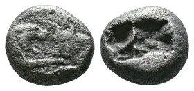 (Silver, 3.13g 11mm)

Kroisos (561-546 BC). AR 1/3 stater.
Confronted foreparts of lion (facing right) and bull (facing left)
Two incuse squares, ...