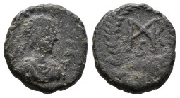 (Bronze.1.19g 12mm) Justinian I. 527-565 AE