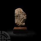 Egyptian Limestone Fragment with Seated God