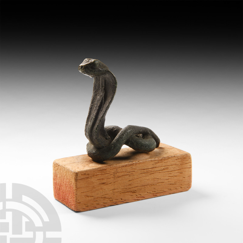 Egyptian Cobra Statuette
3rd-1st century B.C. A lead-alloy figurine of the sacr...