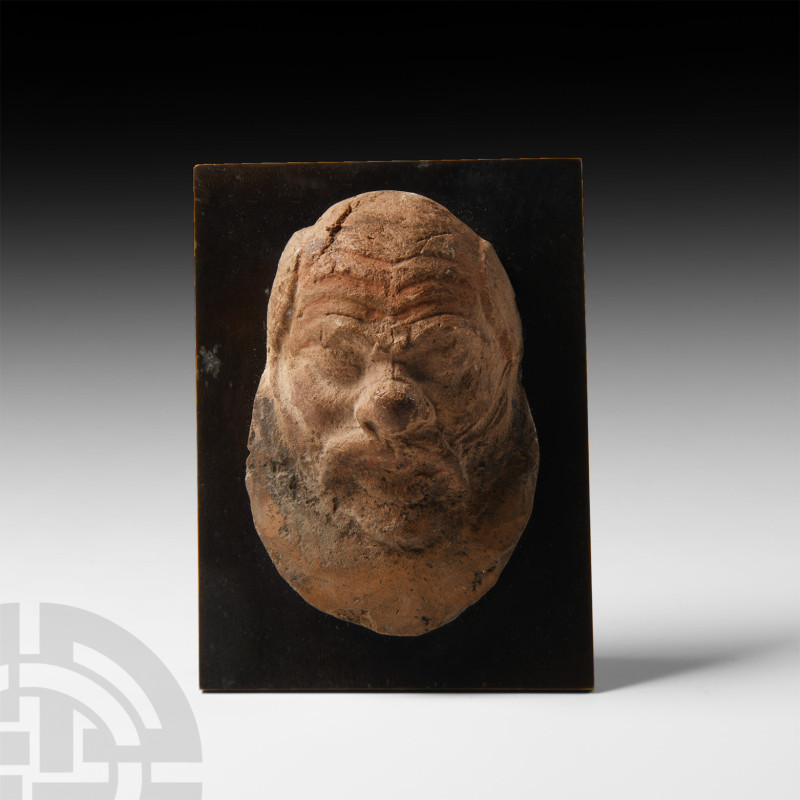 Greek Terracotta Mask of a Satyr
6th-5th century B.C. A terracotta head of a sa...
