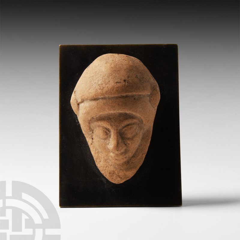 Greek Terracotta Mask with Helmet
6th-5th century B.C. A terracotta model male ...