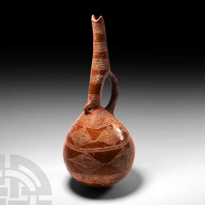 Early Cypriot Red Burnished Ware Jug
Circa 2300-1650 B.C. A ceramic burnished w...