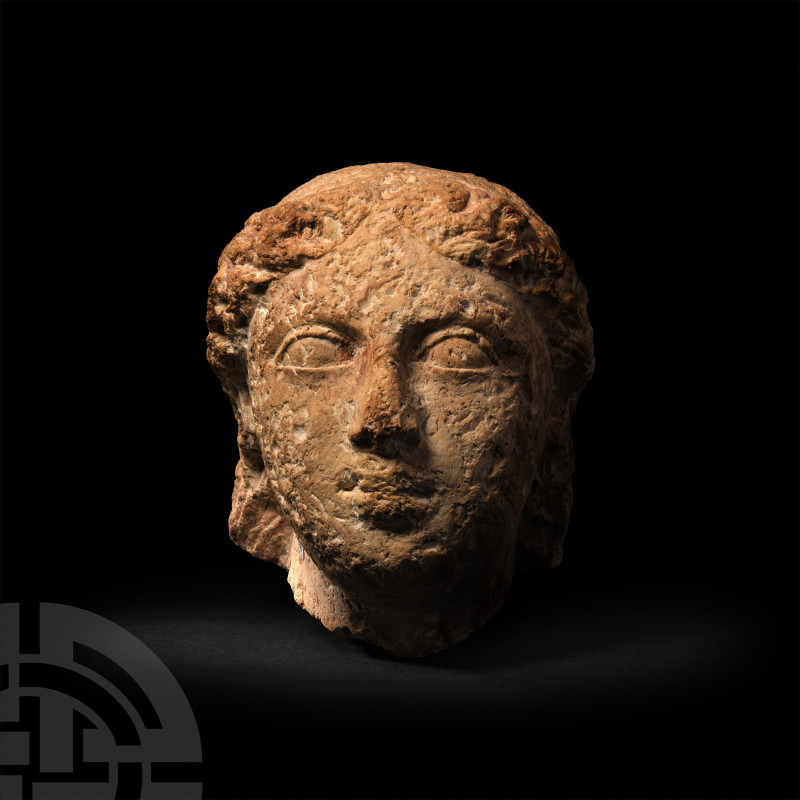 Greek Stone Head of a Female
4th-3rd century B.C. A carved stone head modelled ...