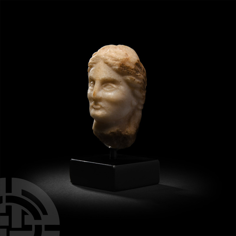 Greek Marble Head of a Woman
2nd century B.C. A marble head of lady carved in t...