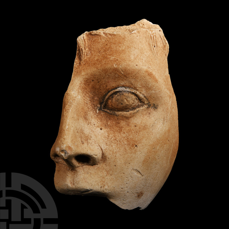 Etruscan Terracotta Fragment of a Face
6th century B.C. An amorphous fragment f...