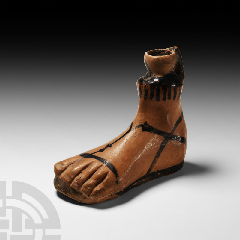 Greek Terracotta Foot-Shaped Aryballos
6th century B.C. A ceramic vessel shaped...