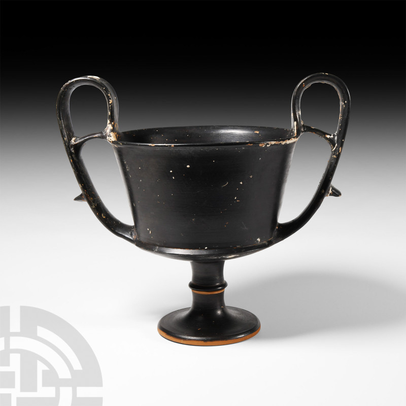 Greek Black Ware Kantharos
5th century B.C. A black-glazed terracotta kantharos...