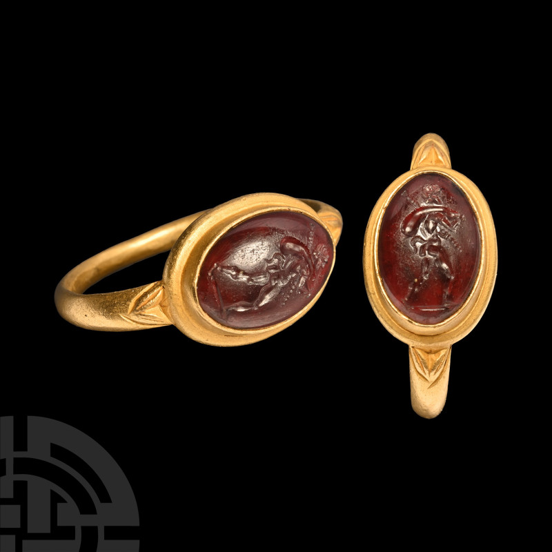 Roman Satyr Traveller Gemstone in Gold Ring
1st-3rd century A.D. A garnet caboc...