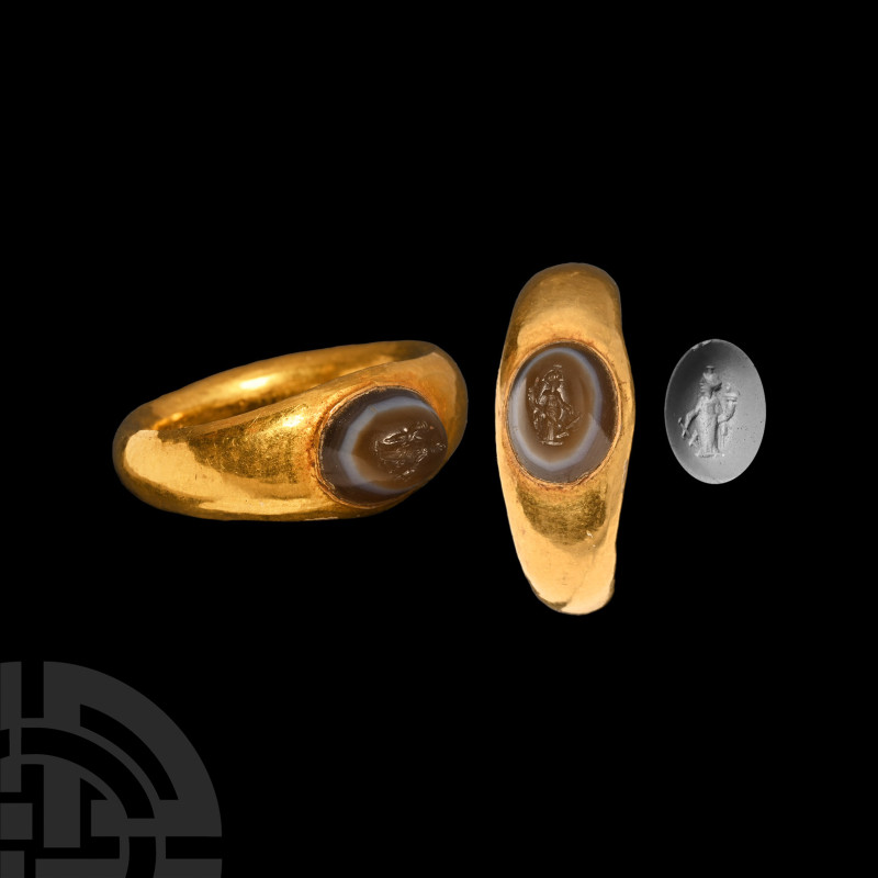 Roman Gold Ring with Fortuna Gemstone
1st-2nd century A.D. A hollow-formed gold...