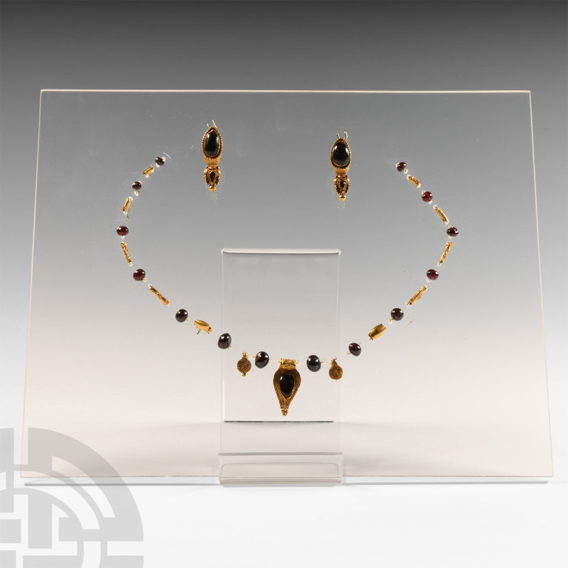 Roman Gold Necklace Element and Earring Set
2nd century A.D. A suite of gold an...