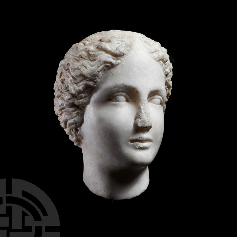 Roman Marble Head of a Young Woman
2nd century A.D. A skilfully carved life-siz...