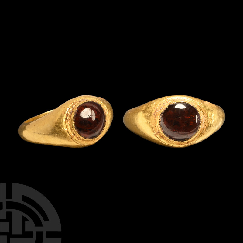 Roman Gold Ring with Garnet Cabochon
1st century A.D. A hollow-formed gold fing...