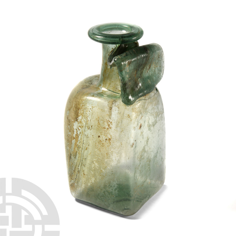 Large Roman Rectangular Glass Bottle
3rd-4th century A.D. A mottled aqua-green ...