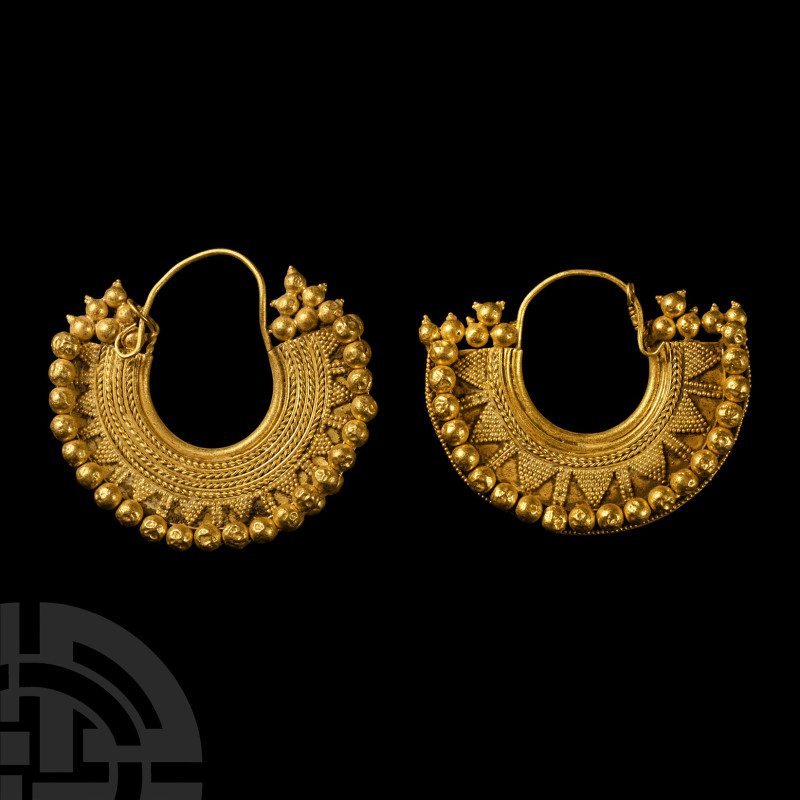 Parthian Gold Earrings
2nd century A.D. A group of two similar crescentic gold ...