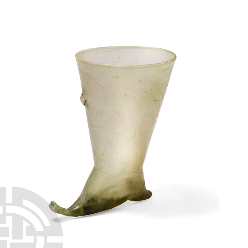 Sassanian Glass Rhyton- Style Vessel
3rd-7th century A.D. A pale green glass ve...