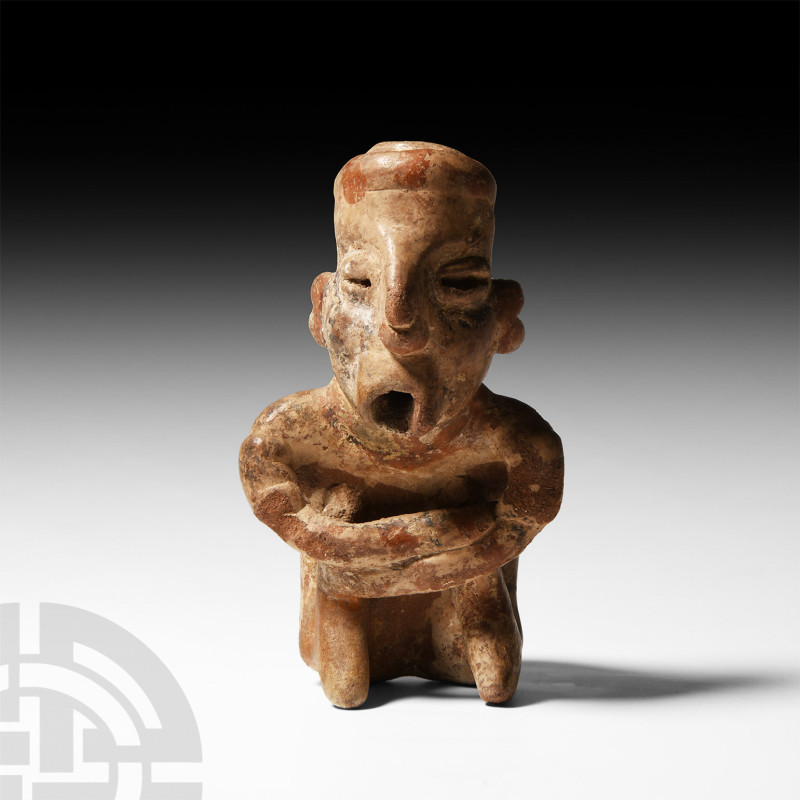 Prehispanic Nayarit Seated Figure
100 B.C.-200 A.D. A ceramic figure of a squat...