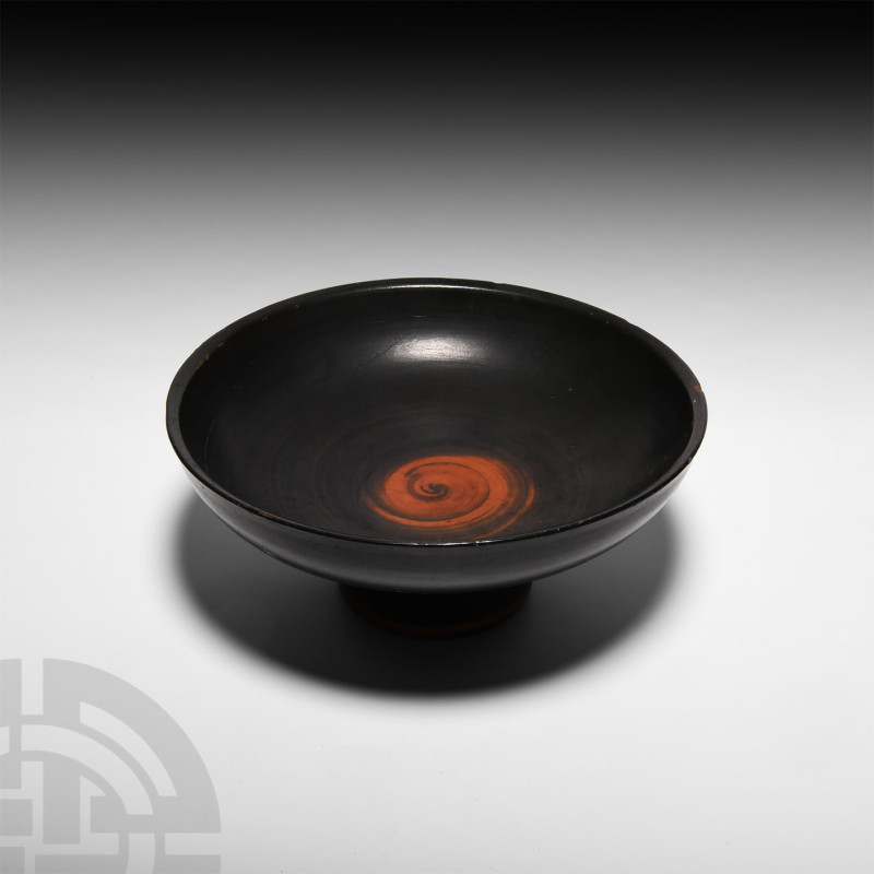 Greek Attic Black-Glazed Kylix
Circa 5th century B.C. A black-glazed kylix or s...