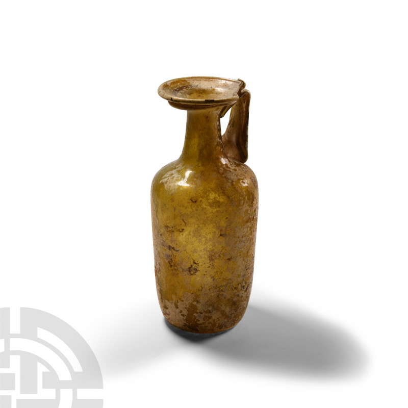 Large Roman Amber Glass Vessel
1st-4th century A.D. A large, roughly barrel-sha...