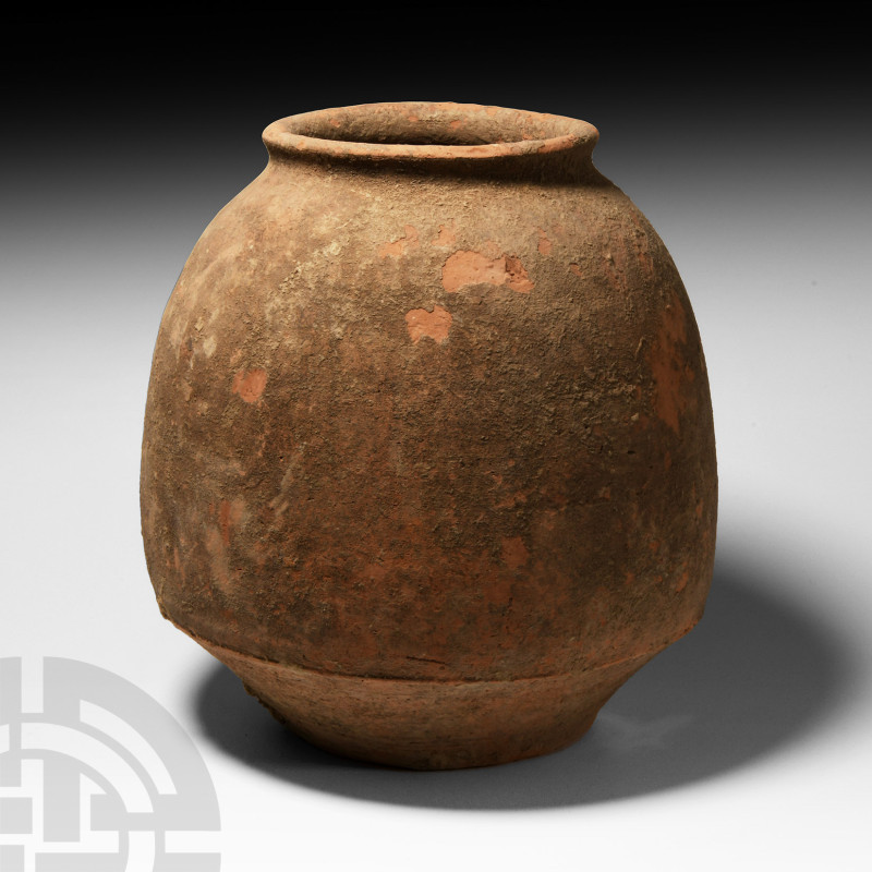 Roman Pottery Jar
4th-5th century A.D. A ceramic jar with a carinated body and ...