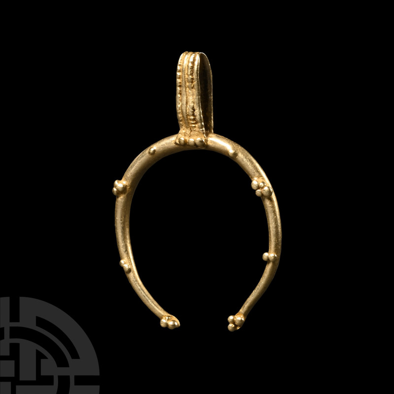 Roman Gold Lunula Pendant
1st-4th century A.D. A crescentic gold lunula pendant...