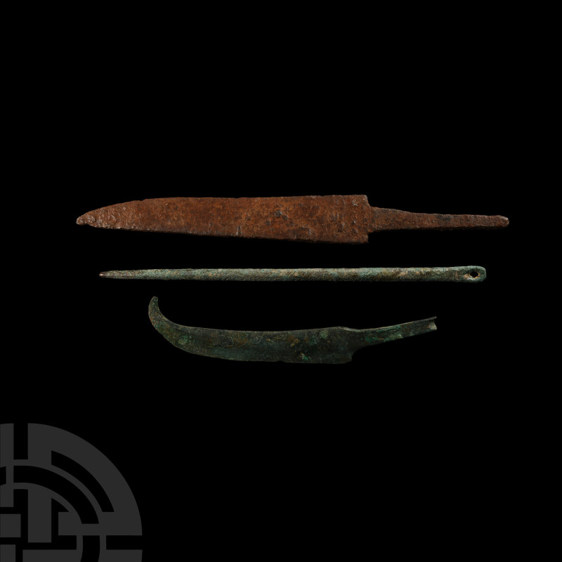 Western Asiatic Implement Group
Late 1st millennium B.C. A trio of copper-alloy...