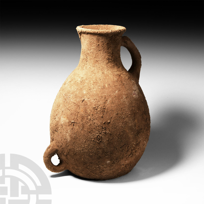 Western Asiatic Terracotta Flagon
2nd-3rd century A.D. An ovoid ceramic flagon ...