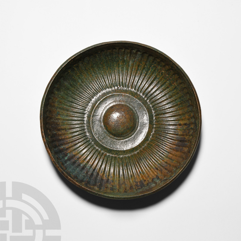 Achaemenid Ribbed Phiale Mesomphalos
6th-4th century B.C. A copper-alloy bowl w...