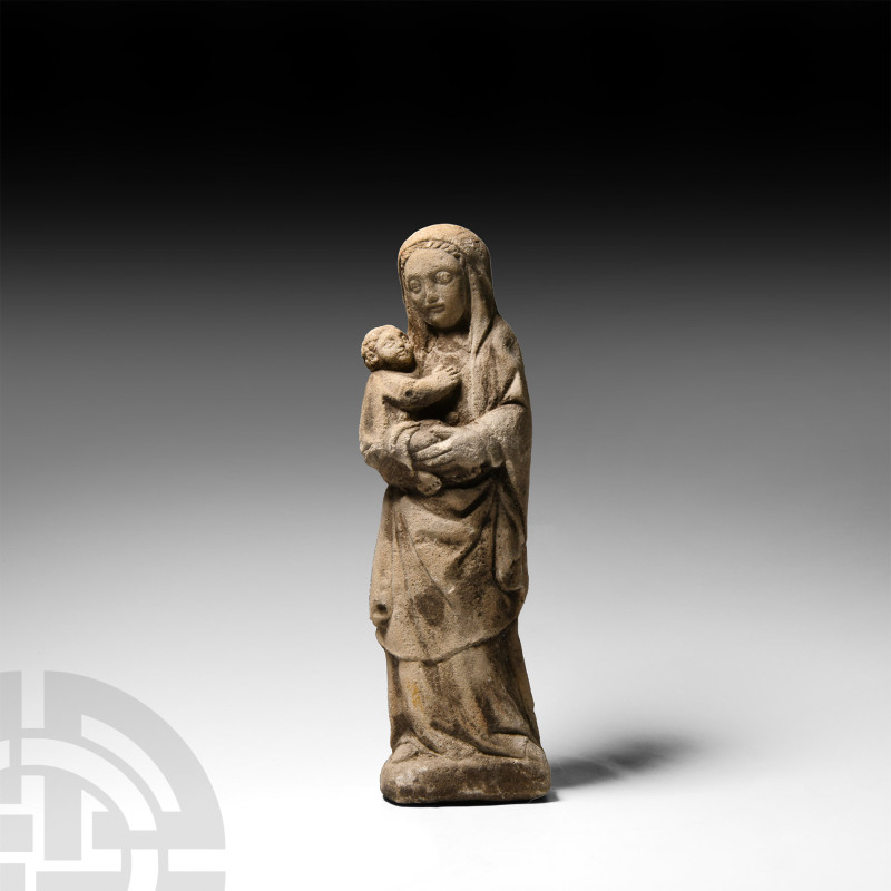 Limestone Madonna and Child Statue
Circa 16th century A.D. A carved volcanic tu...